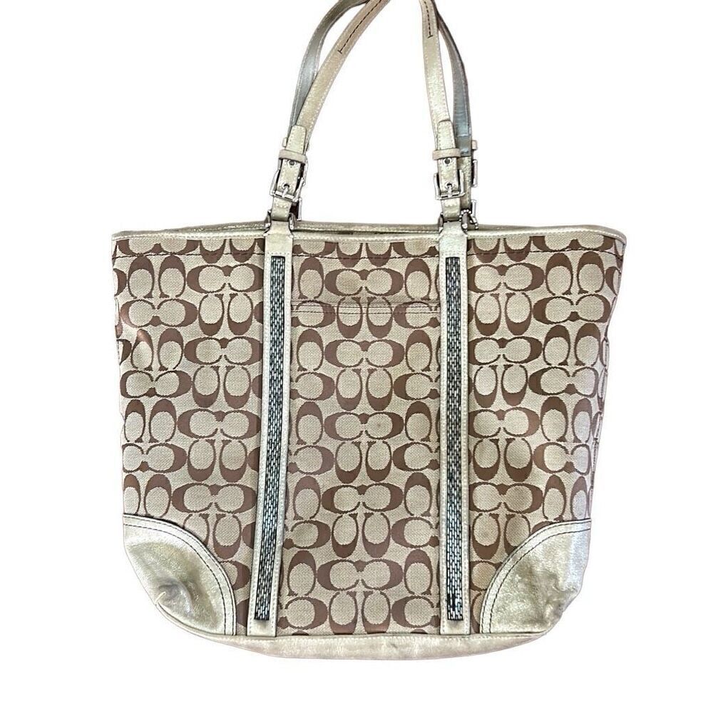 Coach signature tote well loved but still has a lot of life.